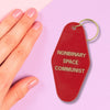 Nonbinary Space Communist Motel Style Keychain in Red and Gold